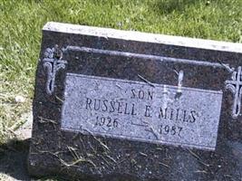 Russell E Mills