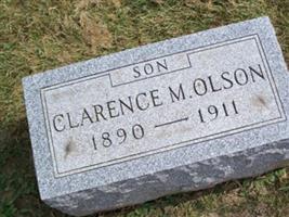 Clarence M Olson