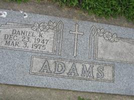 Daniel K Adams