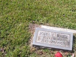 John E White