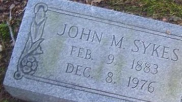 John M Sykes