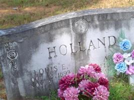 Louis E Holland